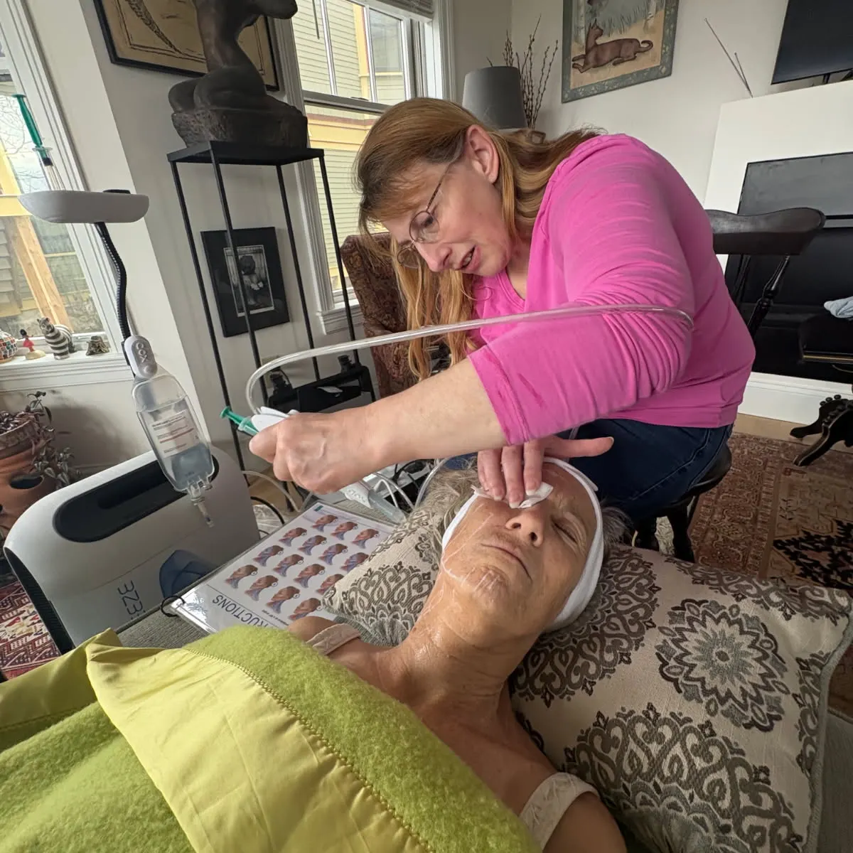 Tiana performing a Breeze skin treatment during an in-home appointment