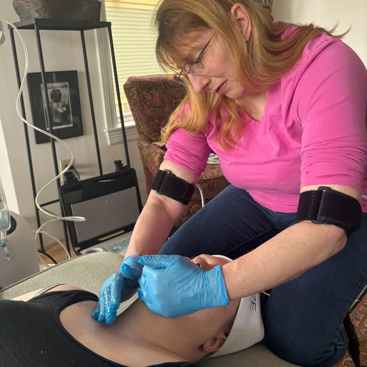Tiana performing a WonderTouch treatment during an in-home appointment